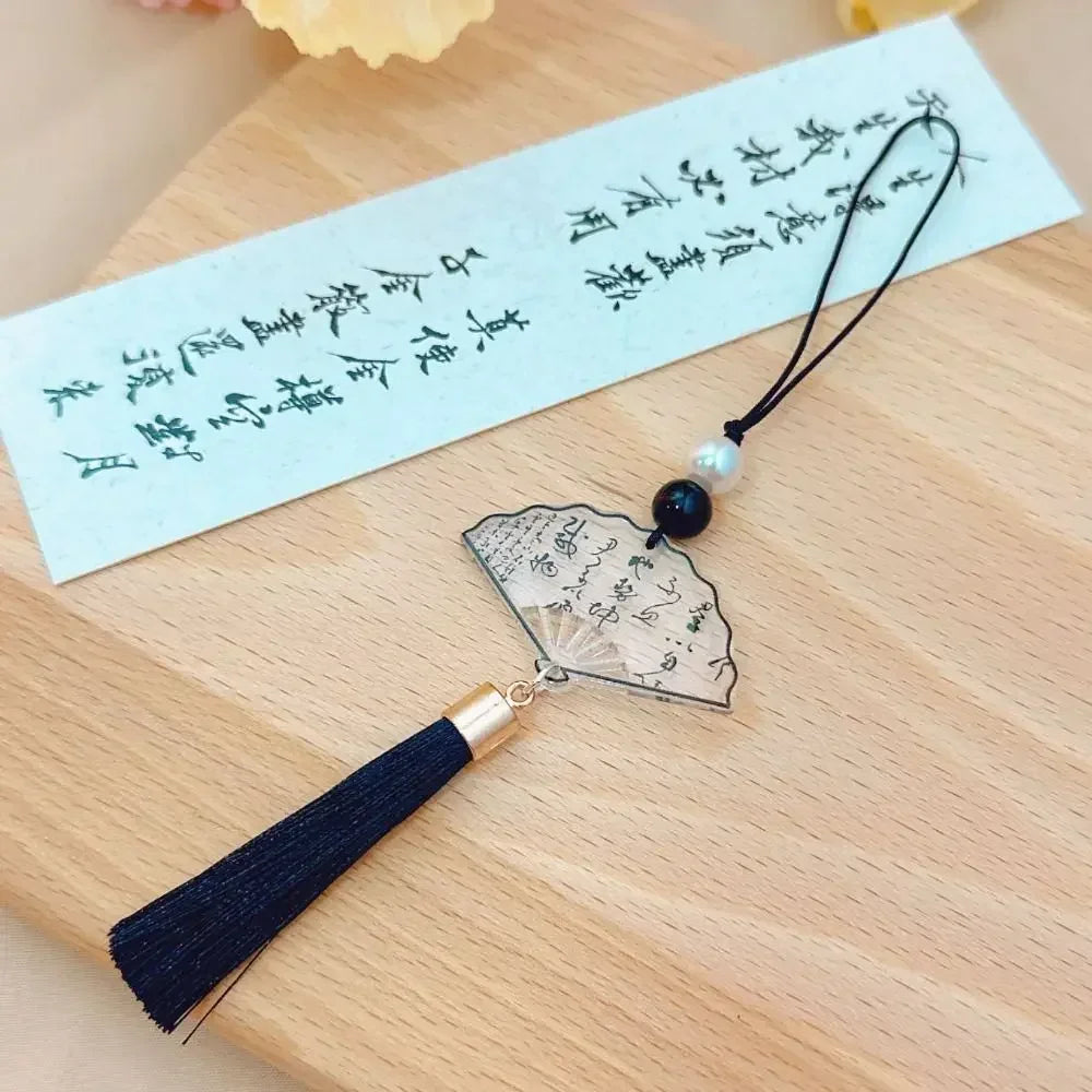 Handmade Chinese-style butterfly phone charm with calligraphy design. Elegant trinket strap and anti-lost cord for phones or bags.