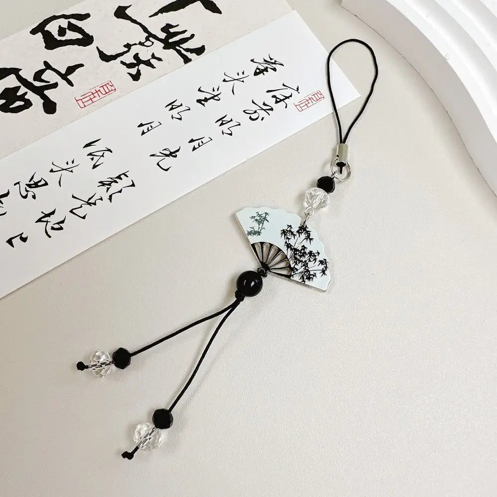 Handmade Chinese-style butterfly phone charm with calligraphy design. Elegant trinket strap and anti-lost cord for phones or bags.