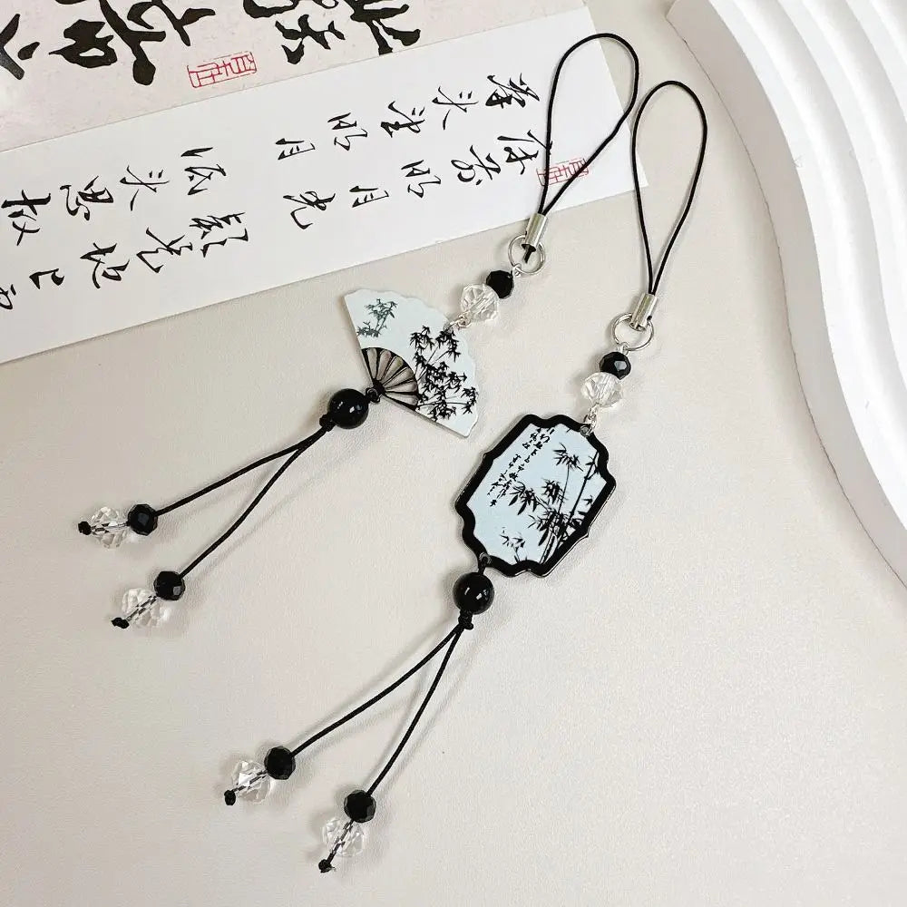 Handmade Chinese-style butterfly phone charm with calligraphy design. Elegant trinket strap and anti-lost cord for phones or bags.