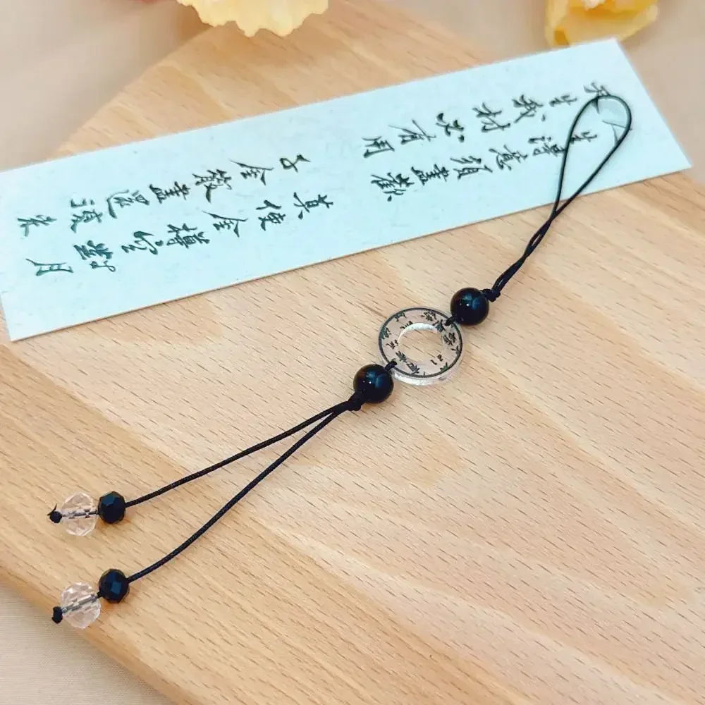 Handmade Chinese-style butterfly phone charm with calligraphy design. Elegant trinket strap and anti-lost cord for phones or bags.